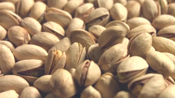 Pistachios. 2 Shots. Slow motion. Horizontal and vertical pan. Close-up. — Stock Video