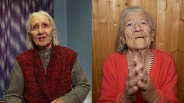 2人の祖母は家からのビデオリンクを介して互いに通信します ある祖母は歌い 踊ります もう一方は彼女をクリップ — ストック動画