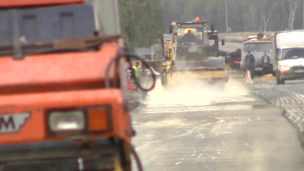 Roadworks. Asphalt pavers laid asphalt. 4 shots — Stock Video