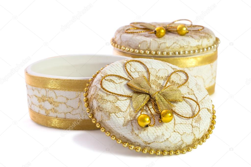 Small ceramic jewelry box isolated over a white background.
