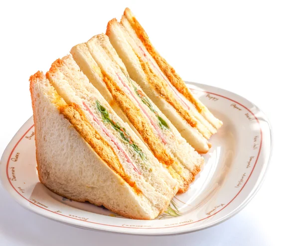 Smörgåsar framför en tallrik av olika fyllningar — Stockfoto