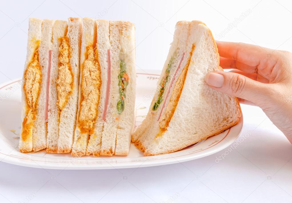 Sandwiches in the woman is hand.