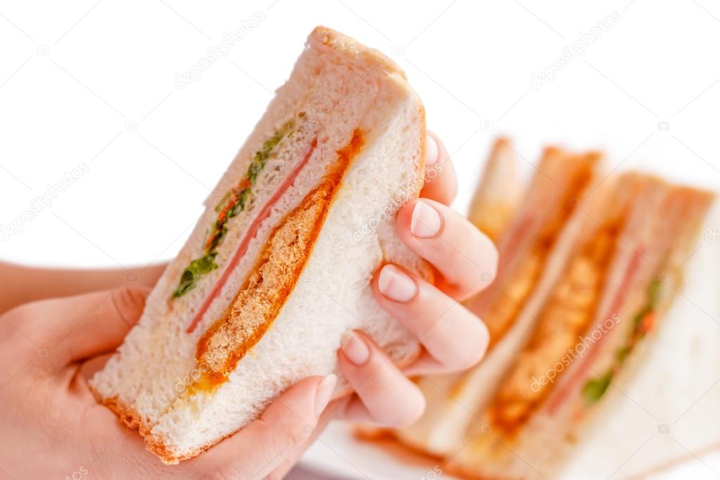 Sandwiches in the woman is hand.