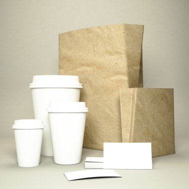 Kahve fincanı kahve çekirdekleri ve kağıt çanta