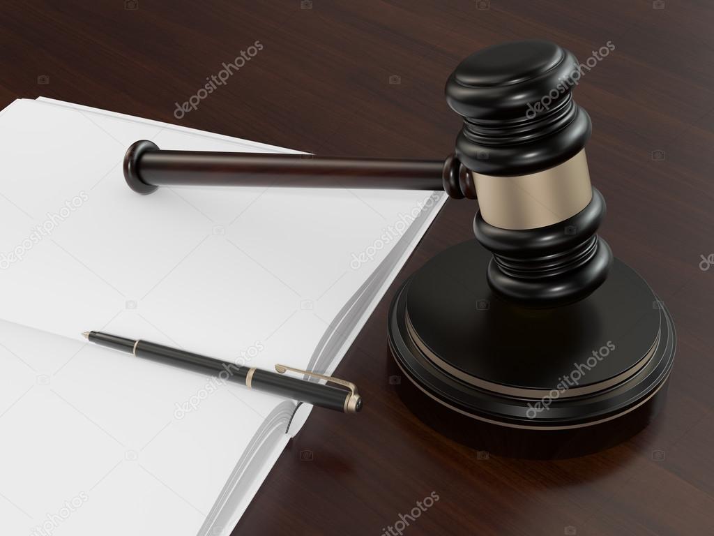 Wooden Judges Gavel And open book on the brown wooden background 