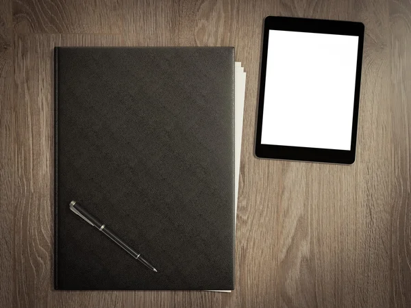 Folder for papers and tablet pc computer on a wooden texture — Stock Photo, Image