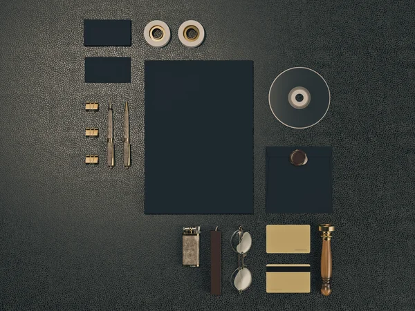 Set of identity elements on black leather background