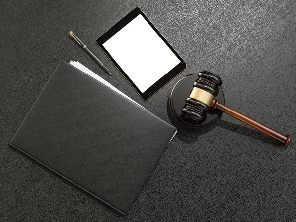 Wooden judges gavel and tablet computer on black leather desk — Stockfoto