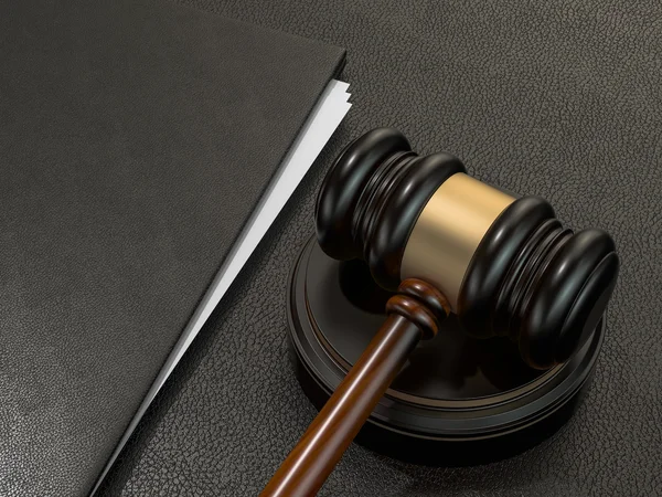 Wooden judges gavel and leather folder on black leather desk — 스톡 사진