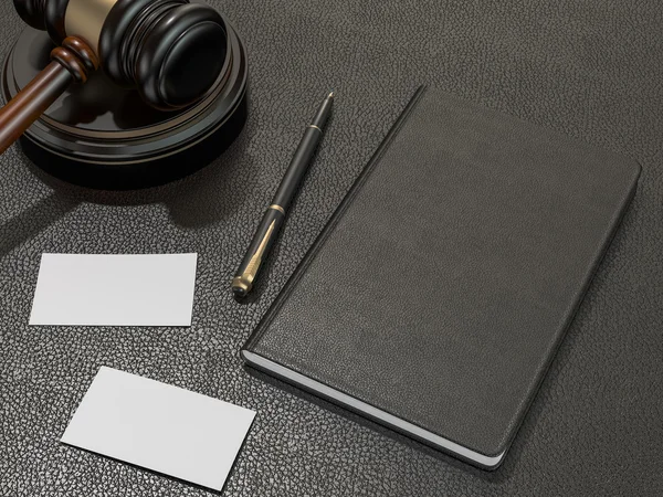 Wooden judges gavel and notebook, business cards on black leather desk — Stockfoto