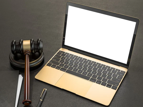 Wooden judges gavel and laptop computer on black leather desk — Stok fotoğraf