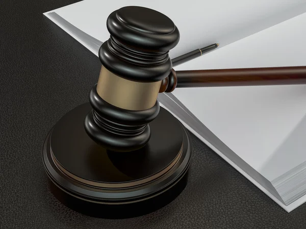 Wooden judges gavel and open book on black leather desk — Stok fotoğraf