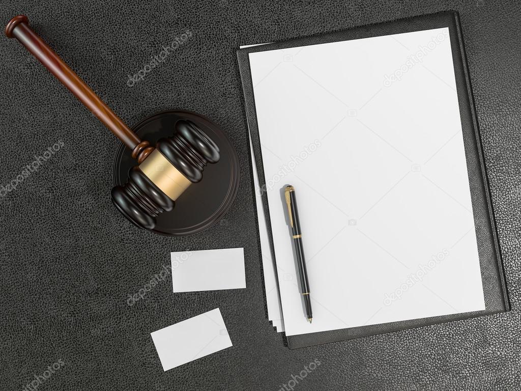 Wooden judges gavel, business cards on black leather desk