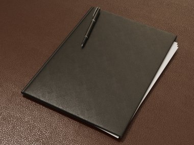 Klasör ve ofis malzemeleri üzerinde kahverengi deri