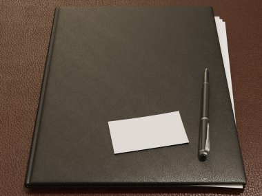 Klasör ve ofis malzemeleri üzerinde kahverengi deri