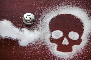 Salt is scattered in the form of a death symbol. Salt causes heart disease high blood pressure clipart