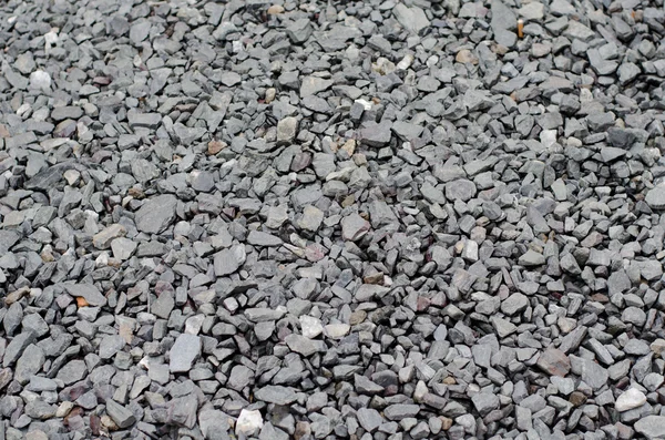 Textuur van een grijze wandelpad van grind en gemalen stenen — Stockfoto