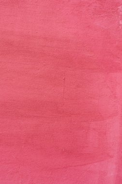 Pembe bir sıva arka plan kaplamalı ve boyalı dış, kaba dökme çimento ve beton duvar doku, dekoratif kaplama 