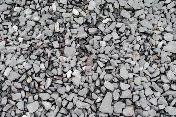 Textura de una pasarela gris de grava y piedras trituradas —  Fotos de Stock