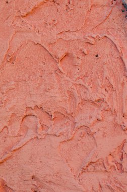 Arka planını canlı turuncu sıva kaplamalı ve boyalı dış, kaba dökme çimento ve beton duvar doku, dekoratif kaplama 