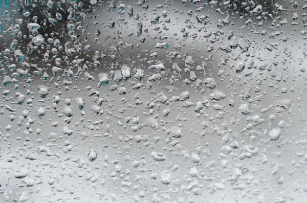 Σταγόνες βροχής στο τζάμι του παραθύρου — Φωτογραφία Αρχείου