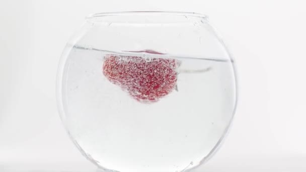 Delicious Strawberry falling into water in slow motion beautiful commercial shot — Stock Video