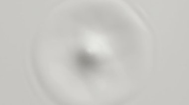 Beyaz Sıvı yüzeyine damlayan süt damlası taç ve dairesel dalgalanmalar oluşturuyor