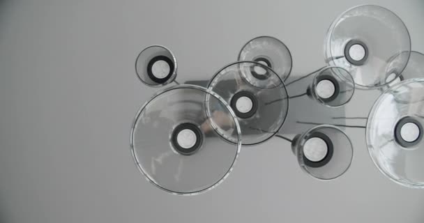 Modern real lustre, minimalist round chandeliers, filmed from below Stock Video