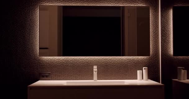 Modern bathroom interior in minimalist apartment with large mirror Stock Footage