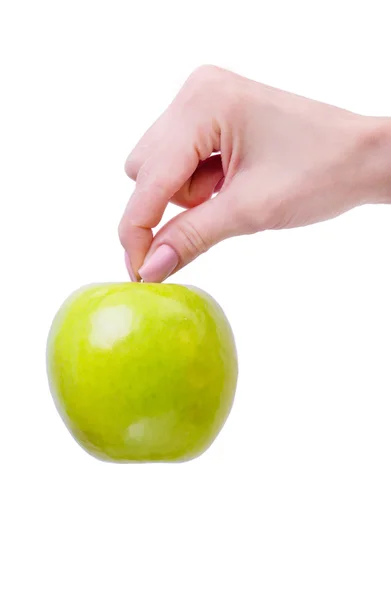 Main de femme avec une pomme isolée sur fond blanc — Photo