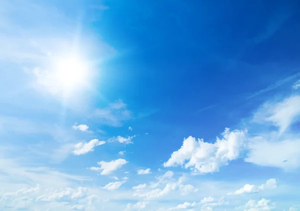 The blue sky with clouds, background