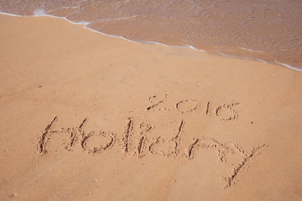 Holiday 2016 handwriting on sand — Stock Photo, Image