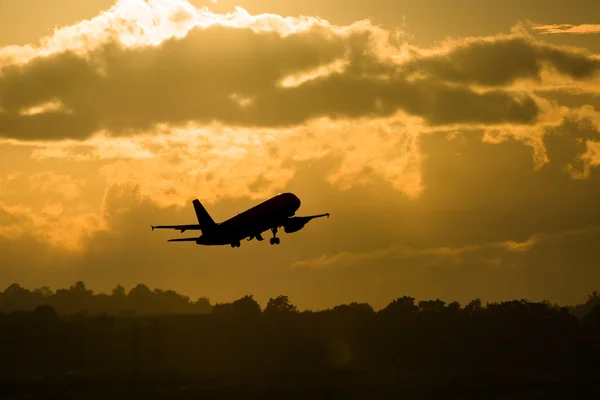 Silhouette plane take off in morning — Stock Photo, Image