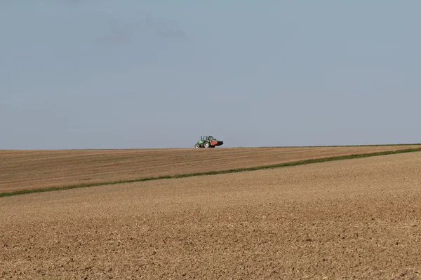 De boer op een tractor — Stockfoto