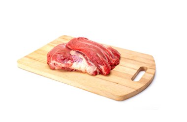 Fresh raw beef on wooden board isolated on white