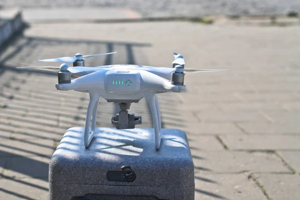 White kvadrocopter ready to fly. A beautiful drone for photos and videos and clearance for his flights. Photo for your design.