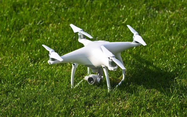 White kvadrocopter ready to fly. A beautiful drone for photos and videos and clearance for his flights. Photo for your design.