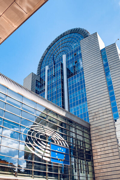 Brussels, Belgium - July 20, 2020: European Parliament offices and European flags.