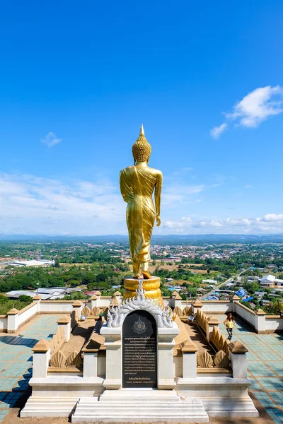 Golden Monk of Buddha with blue sky signature at Wat Phra That Kao Noi, NAN, Thailand — стоковое фото