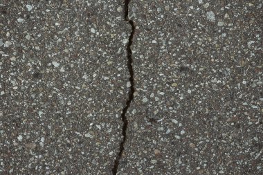 Bozuk asfalt yol yüzeyi dokusuna yakın çekim