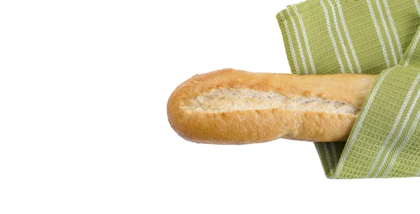 Baguette et serviette de cuisine verte — Photo