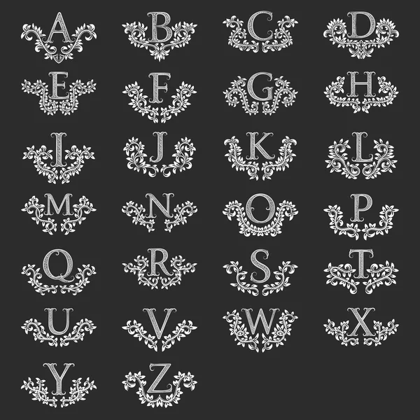 Alphabet latin vintage avec couronnes florales — Image vectorielle