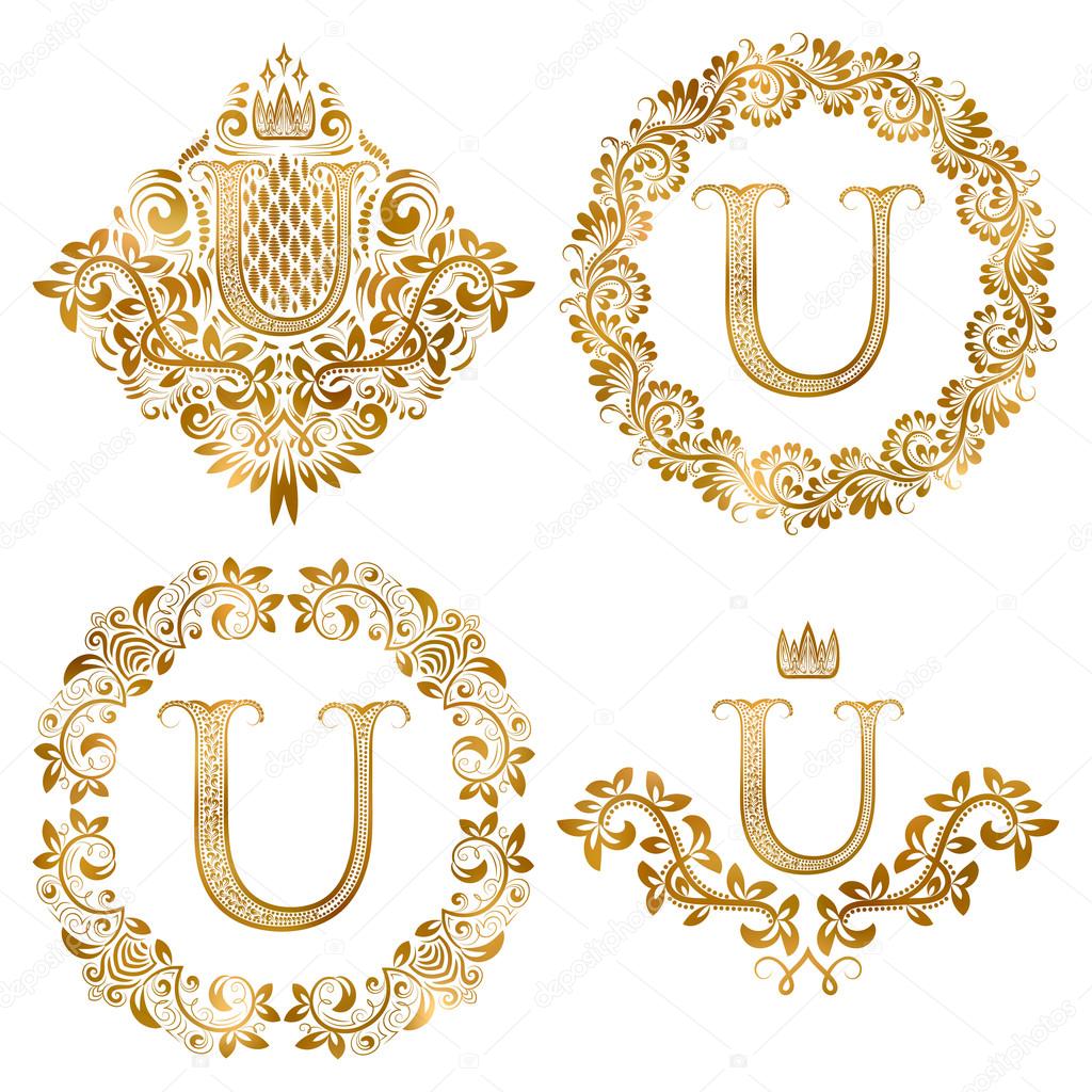 Golden U letter vintage monograms set. Heraldic coats of arms and round frames.