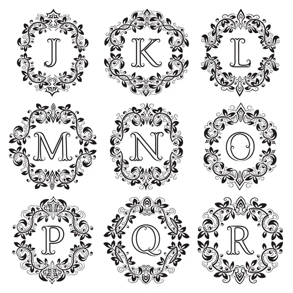 Set of isolated monograms in floral wreath — Stock Vector