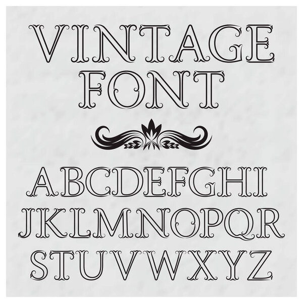 Vintage letters with flourishes. Vintage font in baroque style. Vintage latin alphabet. Black outline capital letters on a gray textured background.