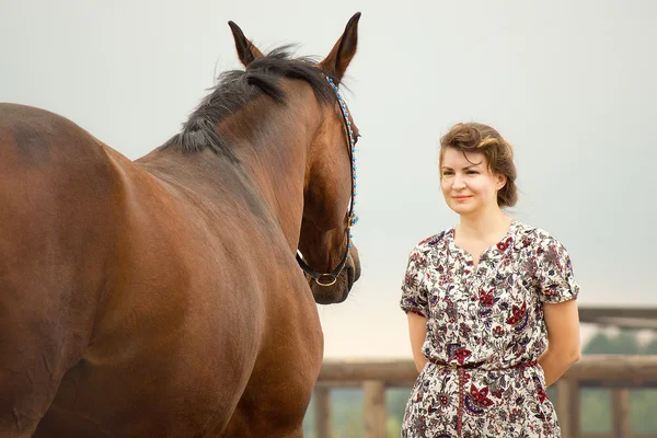 Beautiful girl with free horse — Stock Photo, Image