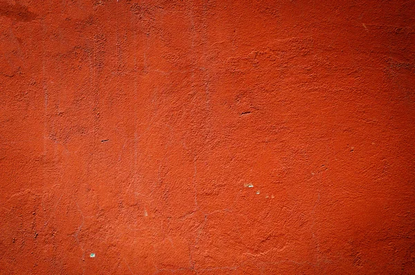 Vermelho resistido gesso parede fundo — Fotografia de Stock