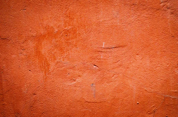 Red weathered plaster wall background — Stock Photo, Image