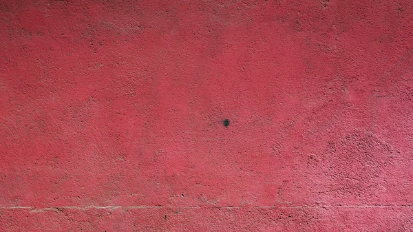 赤色風化石膏壁背景 — ストック写真