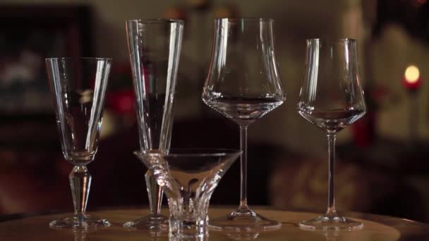 An empty wine glass sitting on a table — Stock Video